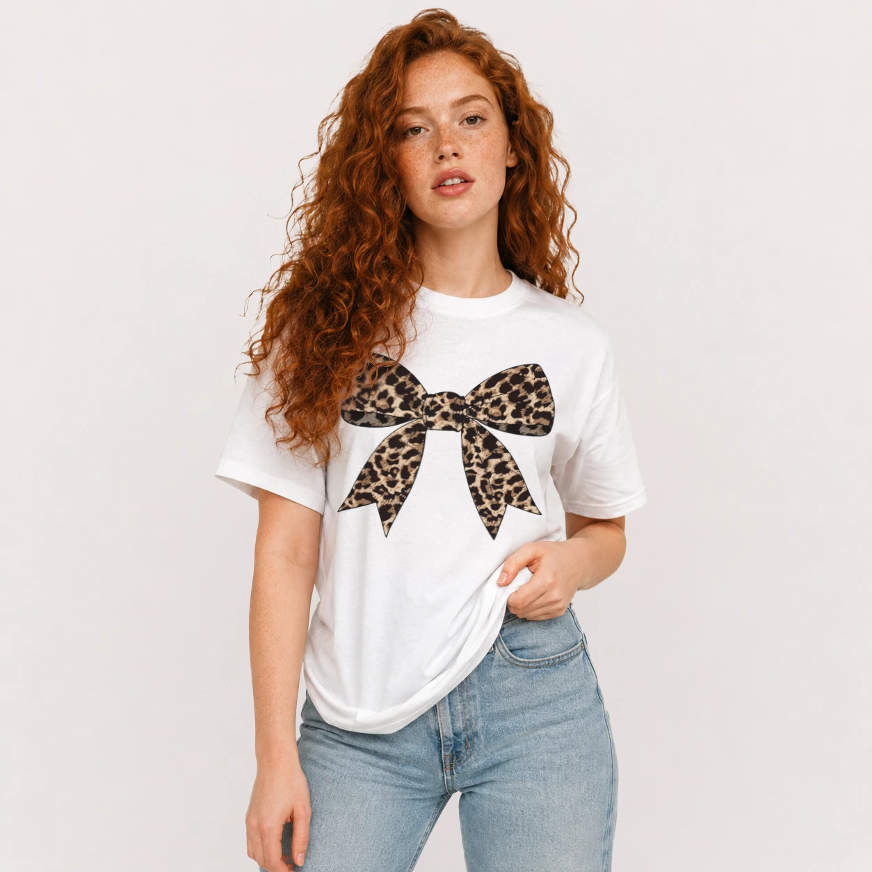 Model Wearing White Leopard Bow Shirt, Leopard Print Coquette Graphic Tee Front View