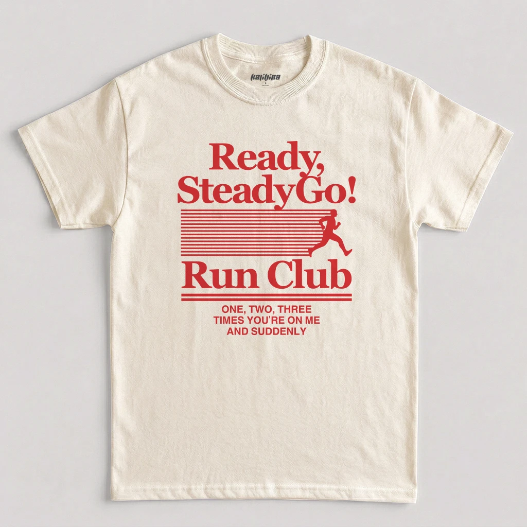 Natural Ready Steady Go Run Club shirt featuring a retro runner graphic, bold typography, and Harry Styles-inspired music design