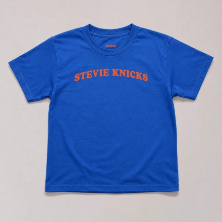 Royal blue Stevie Nicks basketball shirt baby tee featuring bold orange retro typography in a vintage Y2K graphic design inspired by the viral courtside trend and classic rock style