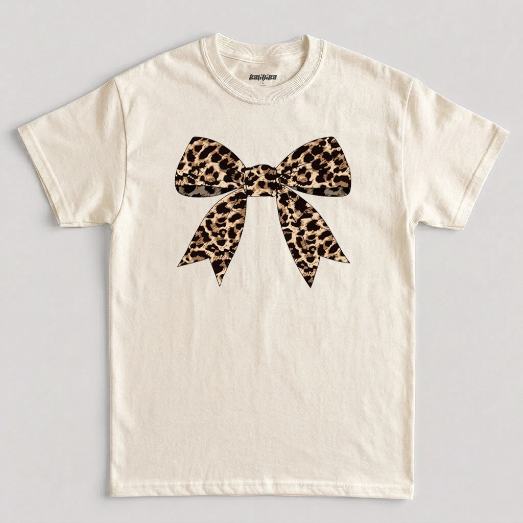 Natural leopard bow shirt featuring a leopard print bow graphic in a trendy coquette style